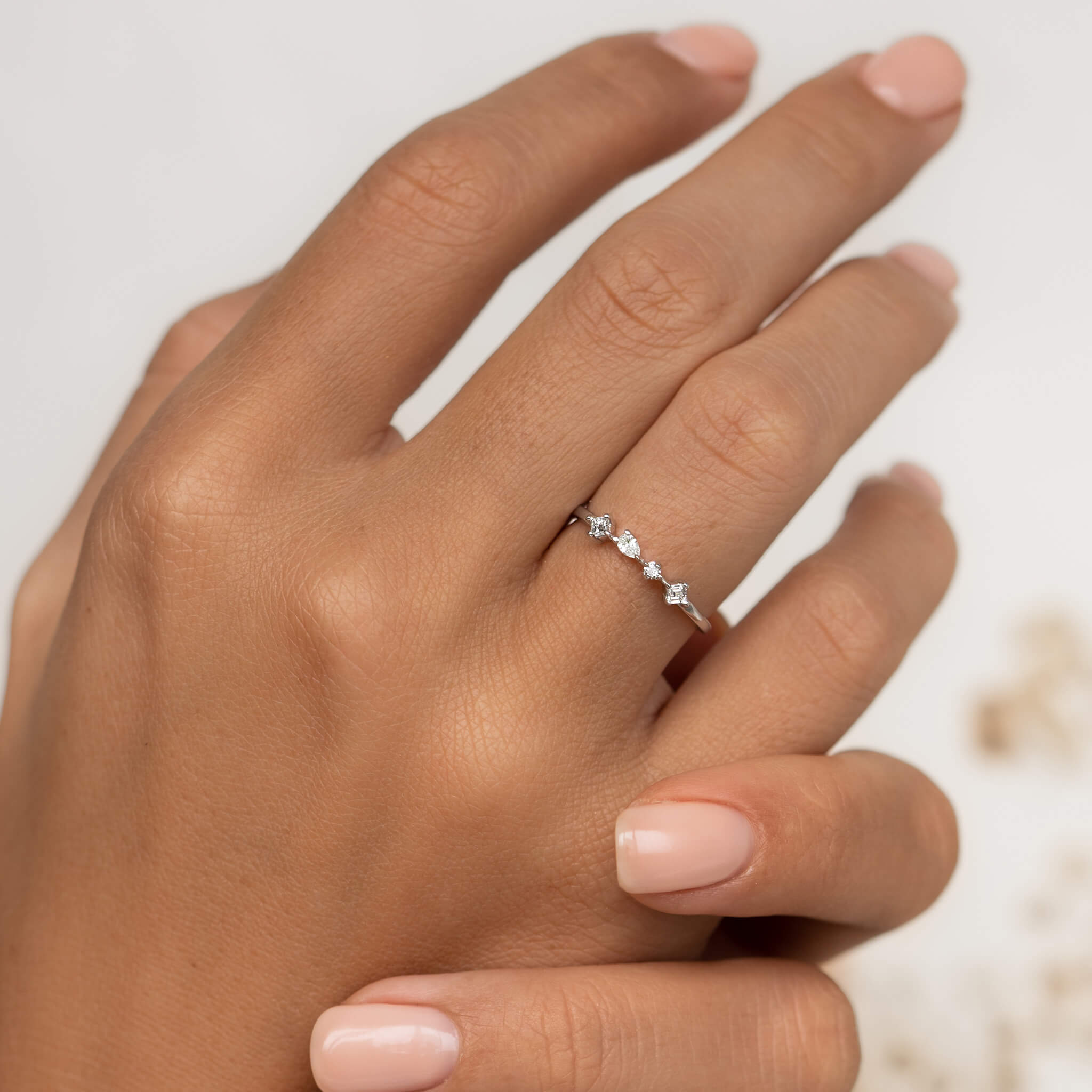 Four lab grown white diamonds on 14k white gold band