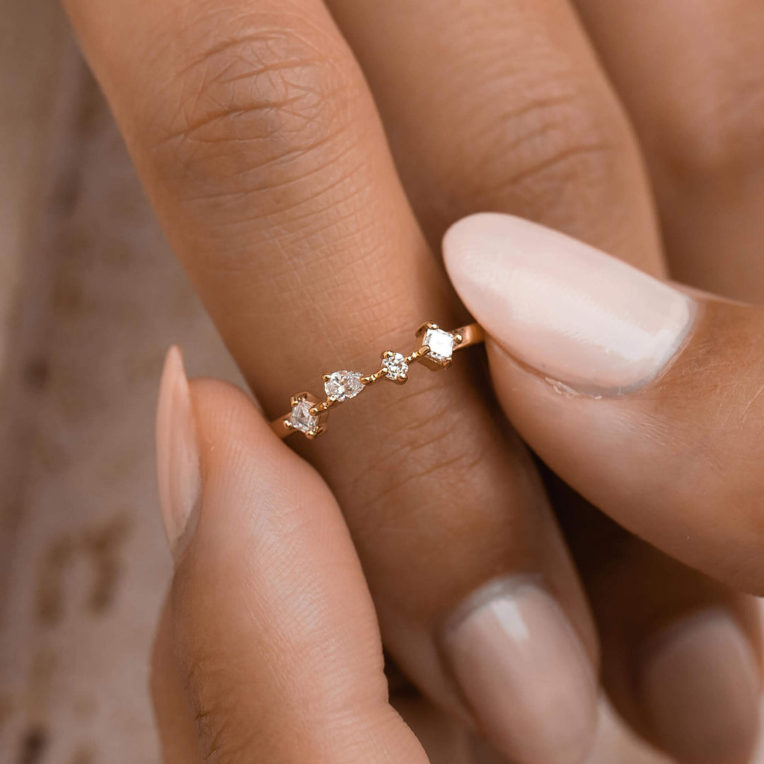 Solid gold ring with four white diamonds