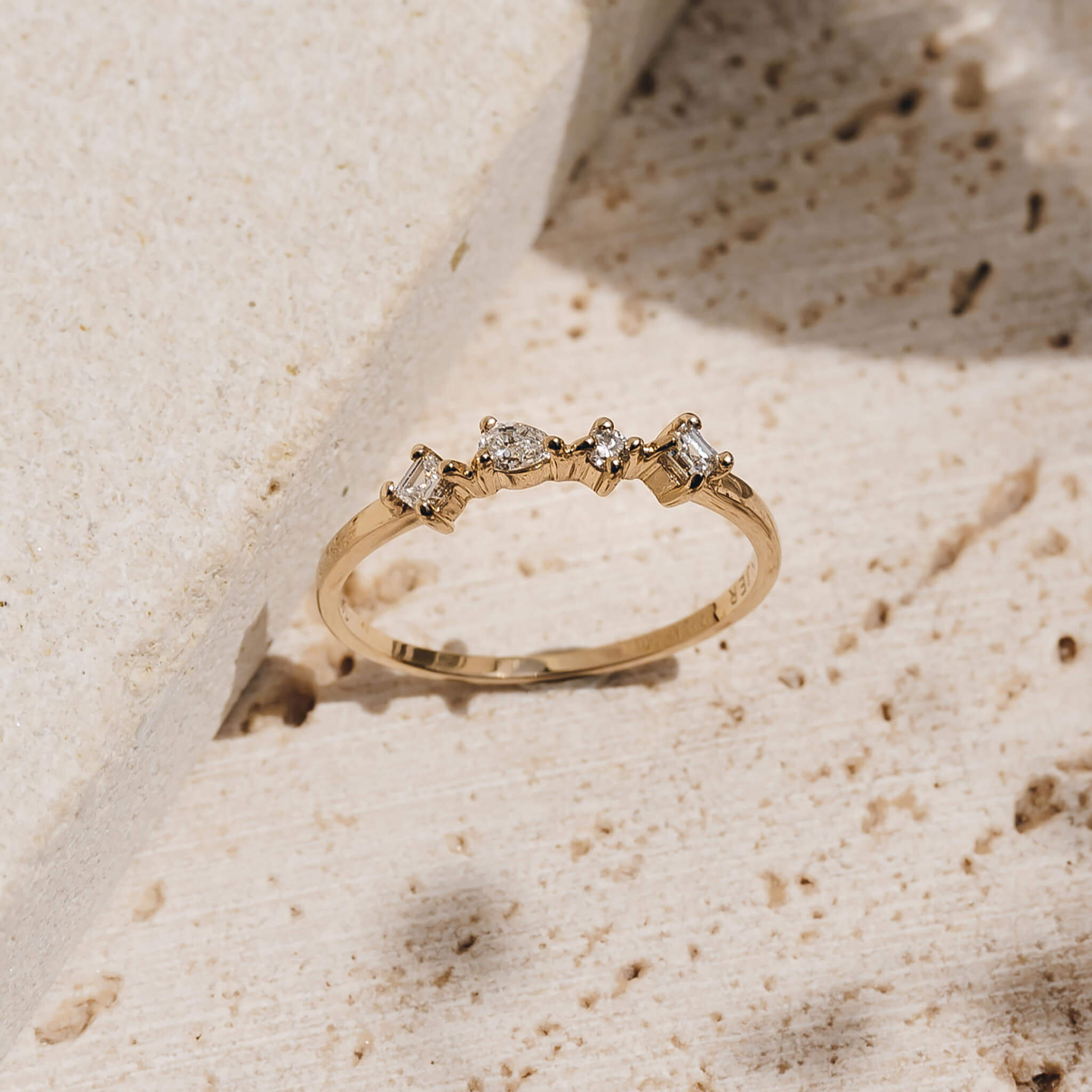 14k yellow gold diamond ring with four irregularly shaped lab grown diamonds