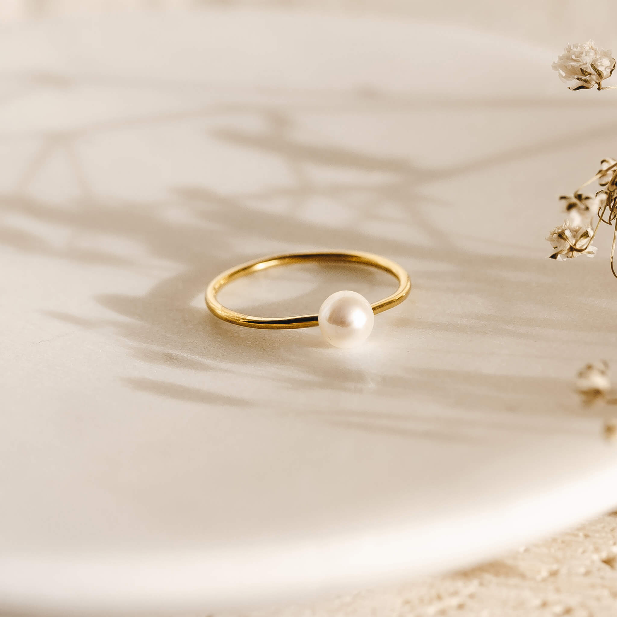 Pearl ring with a pearl on a gold band