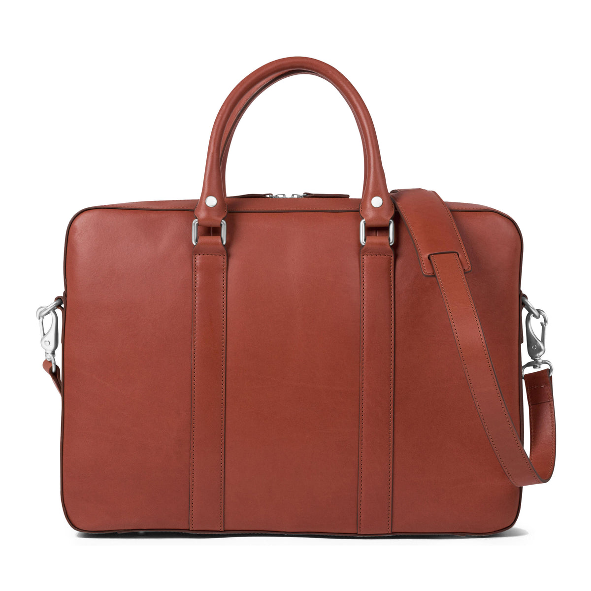 The Soft Briefcase (Private) in smooth leather with dual handles and adjustable shoulder strap on a white background