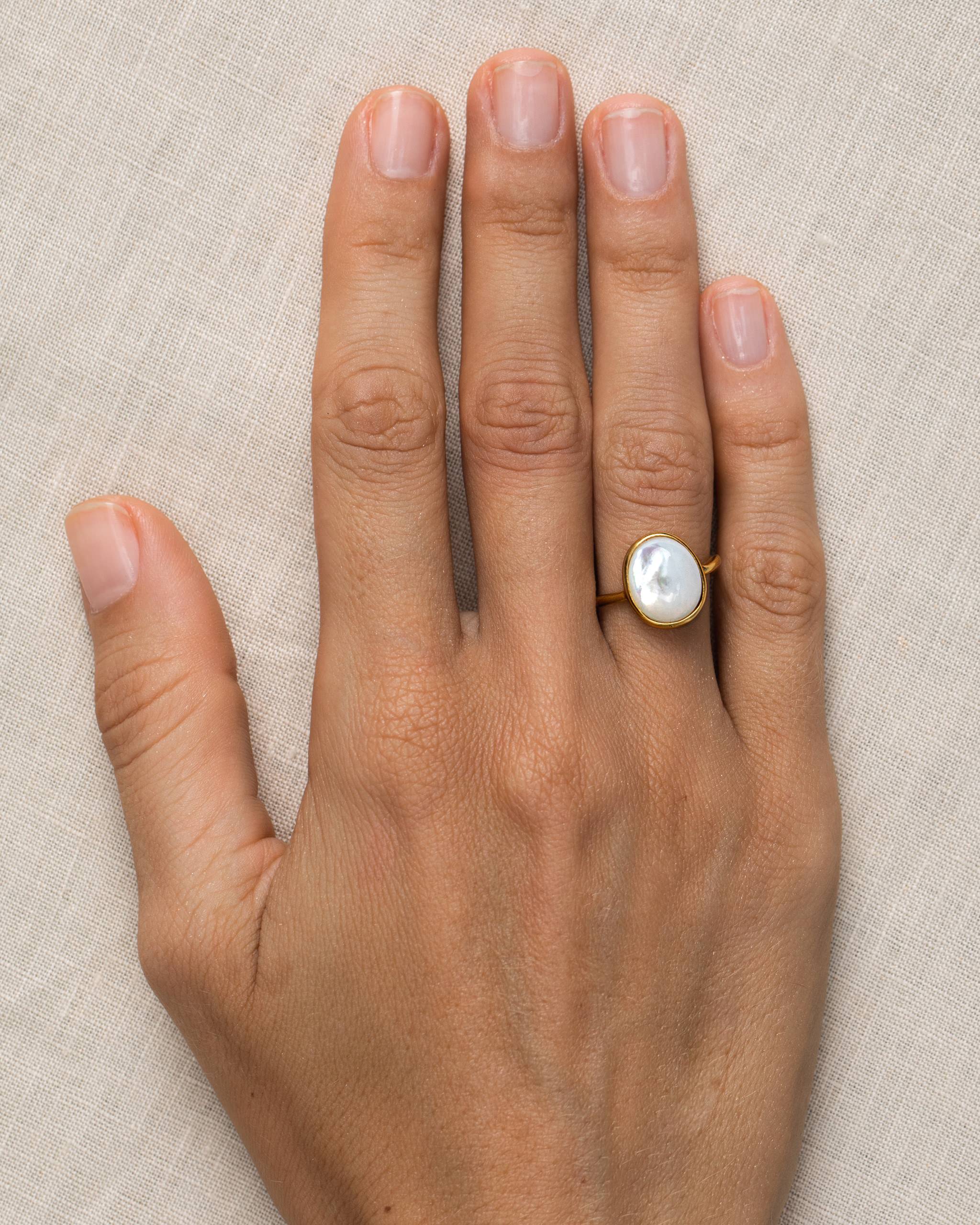 Single mother of pearl stone on gold vermeil band