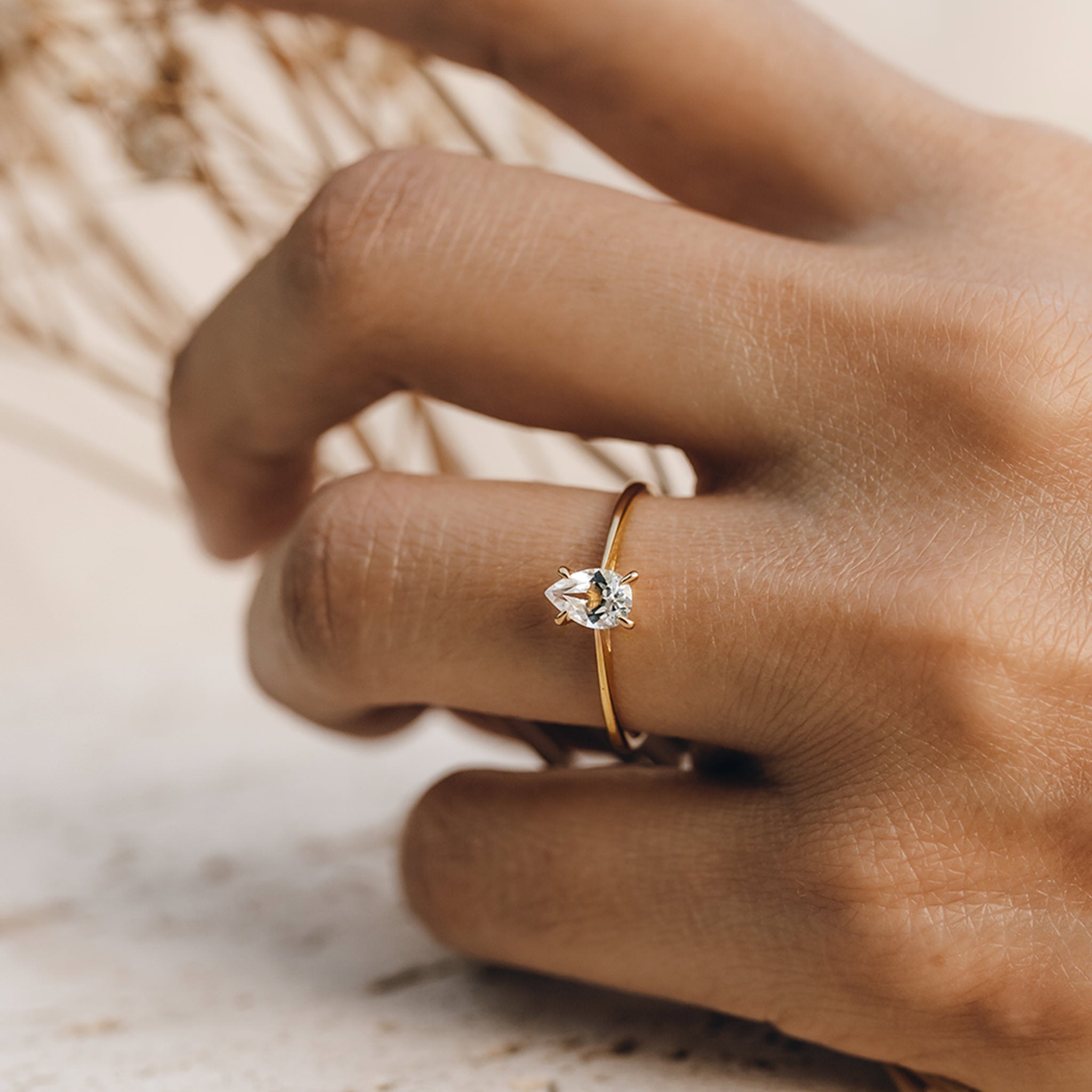 Pear shaped white topaz ring in gold vermeil