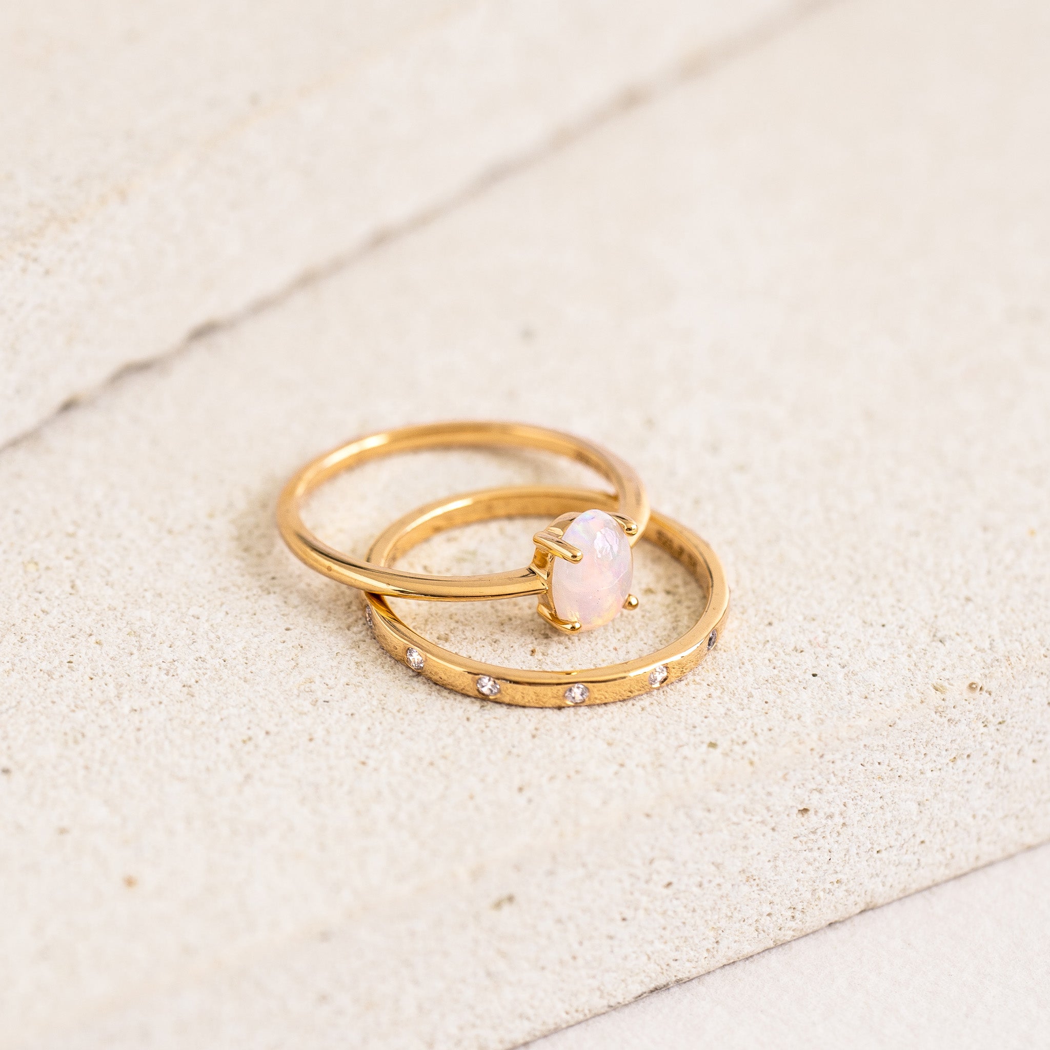 Stacking ring with bezel-set gemstones and opal ring in gold vermeil