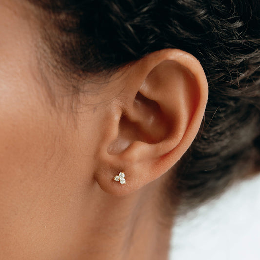 14k yellow gold stud earrings with diamonds in a flower shape