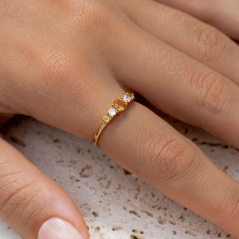Citrine Gemstone and Cubic Zirconia Baguette ring on finger 