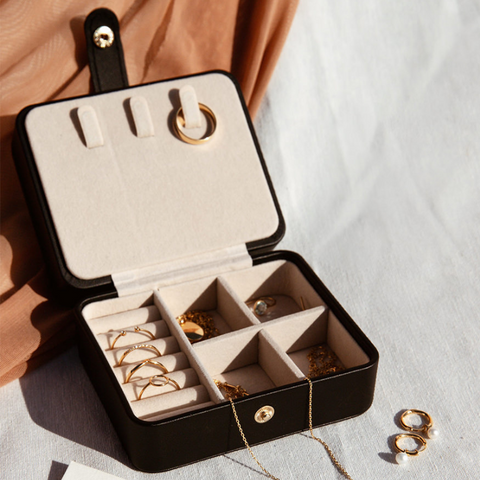 Gold vermeil jewelry in black travel jewelry case