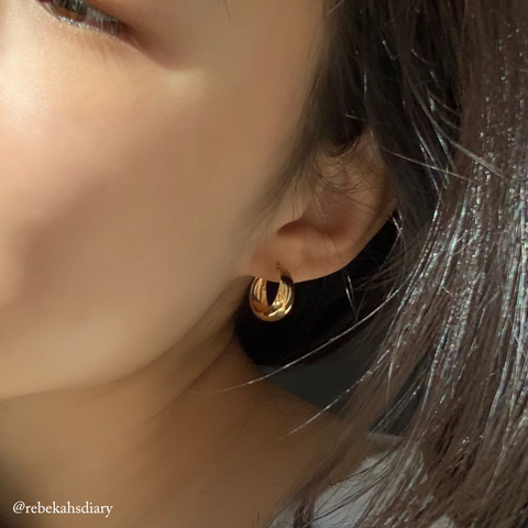 Jorunn Chunky Gold Hoop Earrings on ear