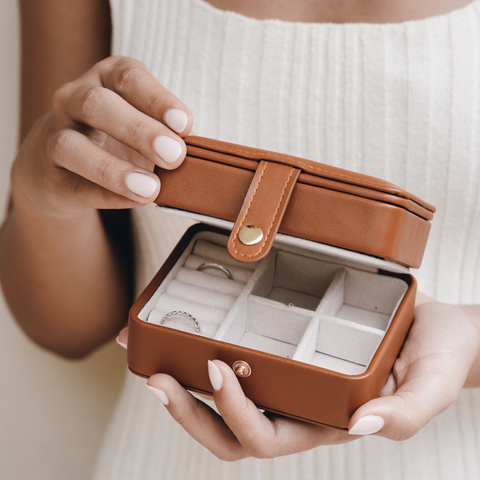 Silver rings in travel jewelry case cognac