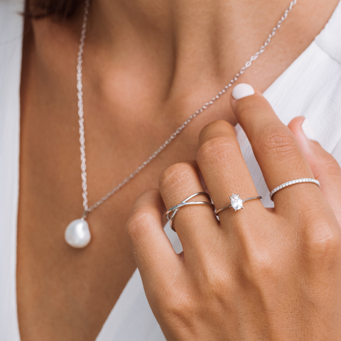Silver baroque pearl necklace and rings