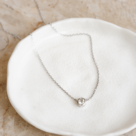 Gemstone necklace silver malin laying on jewelry dish